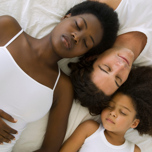 family sleeping peacefully sleep your way to better skin blog post